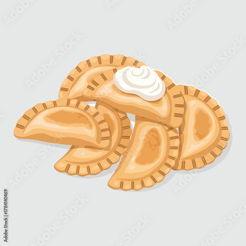 Delicious golden brown pierogies with a dollop of creamy sour cream on top.