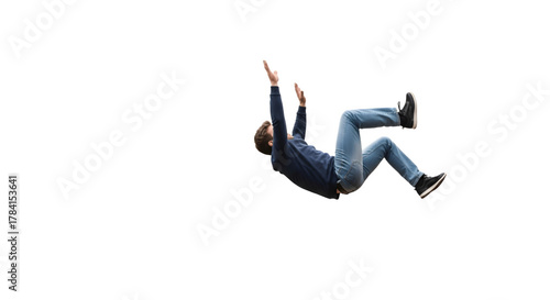 Man in midair falling or jumping with arms raised.
