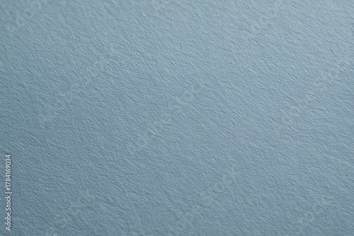 Subtle textured blue paper background offers a calming, serene, and versatile canvas for elegant design projects and modern branding.