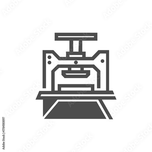 Stylized dark grey icon of an industrial press machine with a top handle on a white background.