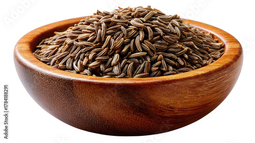 Cumin Seeds in Wooden Bowl: A close-up shot of a rustic wooden bowl brimming with aromatic cumin seeds, showcasing the texture and rich color of this culinary essential.
