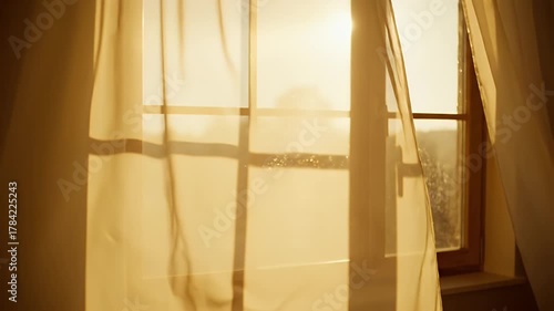 Warm Sunlight Streaming Through Sheer Curtains Blowing Gently.
