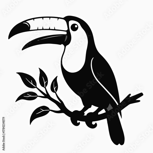 Black silhouette of a toucan on a branch with leaves