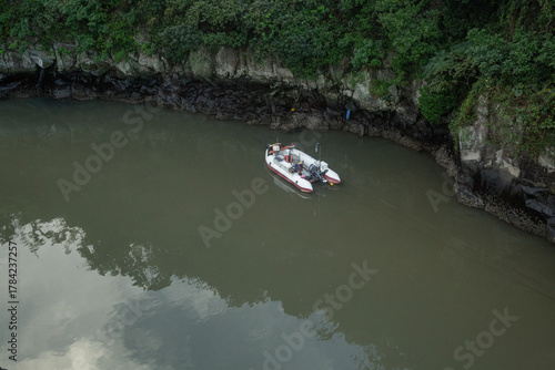 a floating boat in silent pond in jeju island