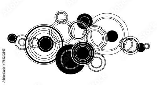 An abstract arrangement of overlapping circles and rings in varying sizes, featuring black and white graphic design.