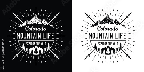 Colorado mountain life emblem with mountains, trees, arrows and sunburst, presented in black and white on black and white backgrounds