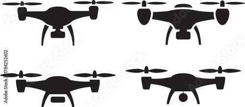 Four black silhouette icons of drones quadcopter aerial