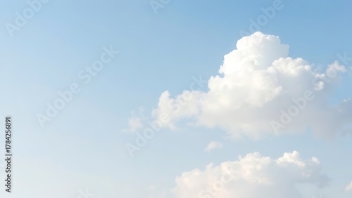troposphere. Clear blue sky with fluffy white clouds creating a serene minimalistic background. travel magazines, destination branding, designed for outdoor magazines and nature guides.