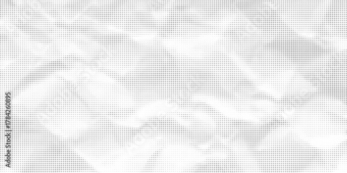 Halftone faded gradient texture. Grunge halftone grit background. White and black sand noise wallpaper.