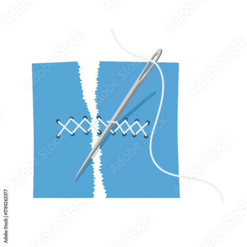 Needle and thread repairing torn fabric. Sewing a cross stitch on blue cloth.