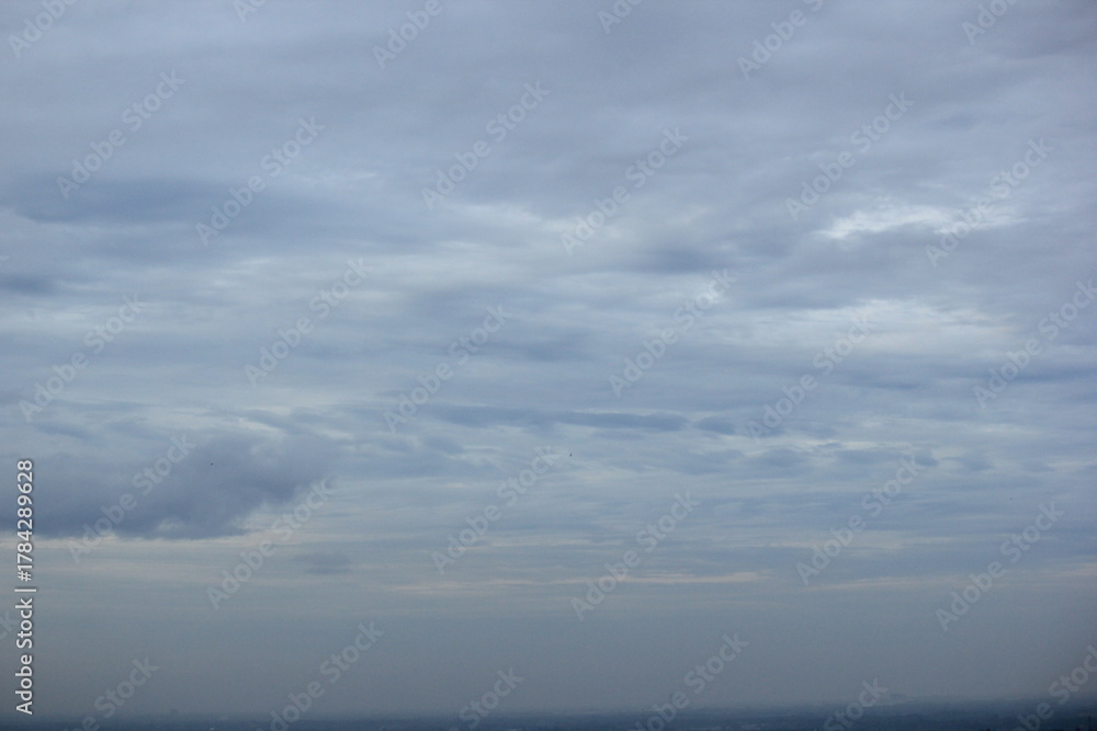 Fototapeta premium Overcast Sky with Layers of Gray Clouds
