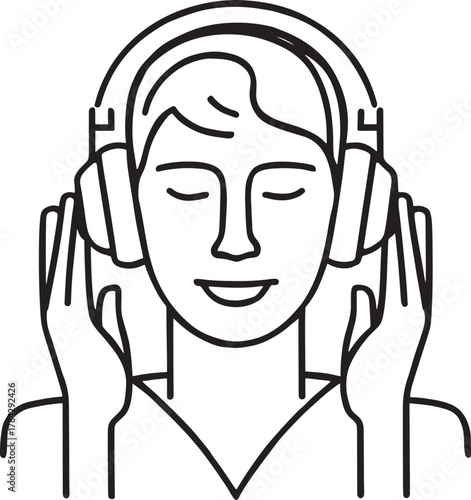 Person with eyes closed listening to music with headphones