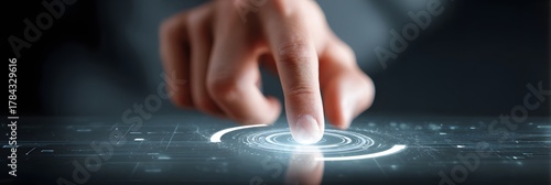 Finger approaching and pressing a futuristic illuminated button with a glowing effect, creating a sense of activation or initiation against a dark background, conveying technology, innovation, and...