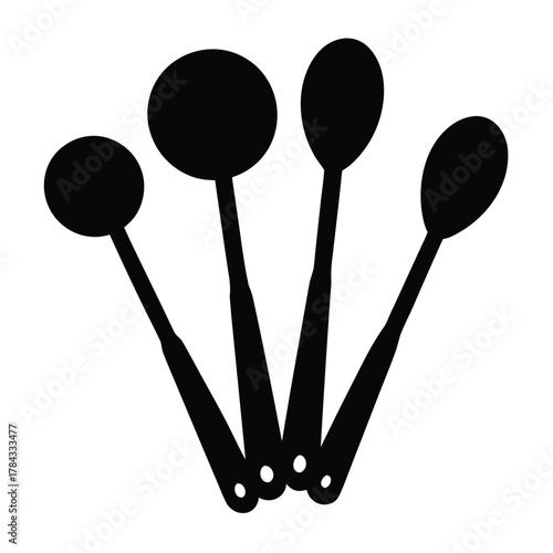 Measuring spoons of different sizes for liquid and dry ingredients in kitchen