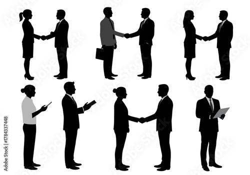 Silhouetted Business People Engaging in Handshakes