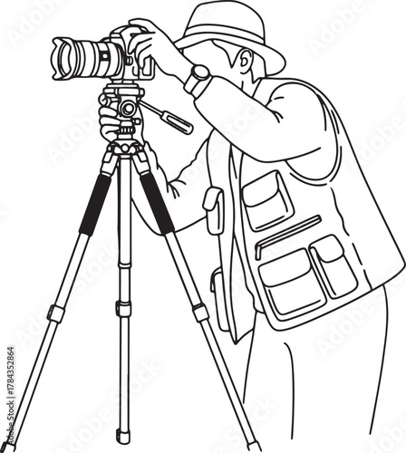 Vintage photographer with old camera and tripod