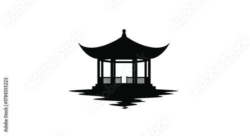 Elegant black silhouette of a traditional pagoda pavilion reflected in still water