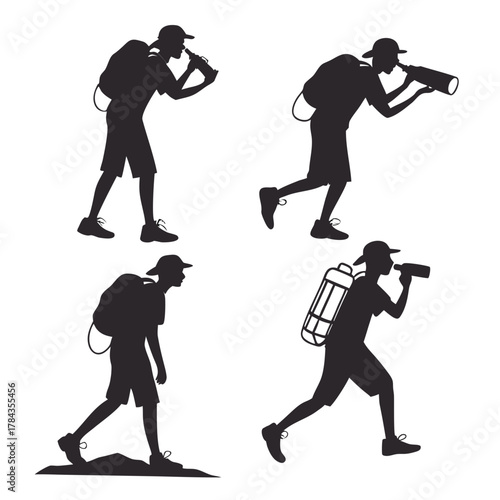 Four black silhouettes of hikers with backpacks walking