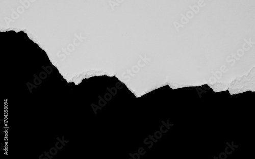 ripped paper on black background.