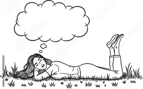 Young woman lying in grass with thought bubble above her head