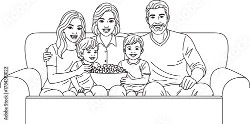 Family relaxing together watching television on a couch