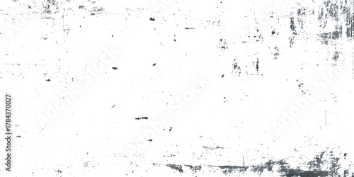 Abstract grunge texture featuring dynamic black ink splatters, scratches, and distressed marks on a clean white background.
