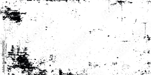 Abstract black ink splatter texture with scratches and grunge overlay on white background.