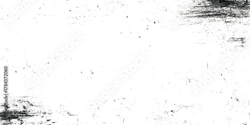 High-resolution black and white grunge texture with distressed ink splatter and rough distressed and subtle scratches.