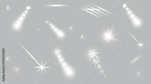 Glowing light effects and sparkling star burst elements on transparent background
