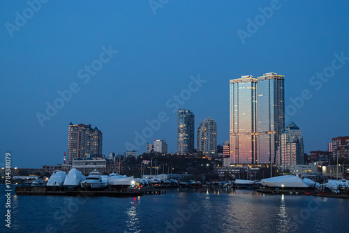 Evening Vladivostok. Embankment at sunset. A beautiful city by the sea.