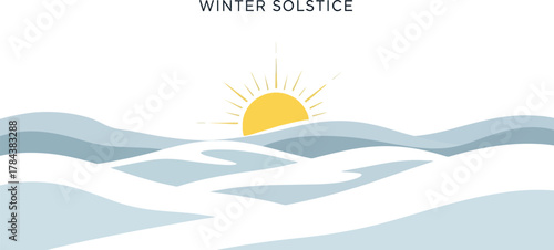 Sun rising over snow-covered hills for winter solstice