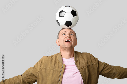 Handsome mature man playing...