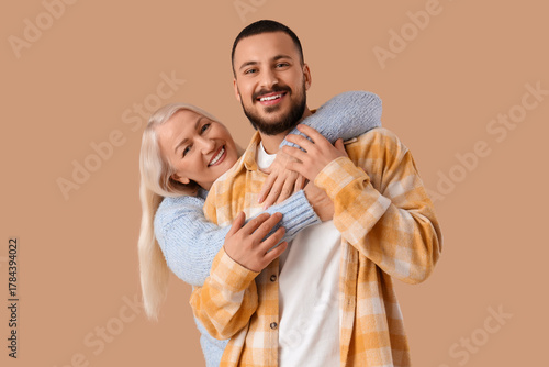 Mature woman hugging her so...
