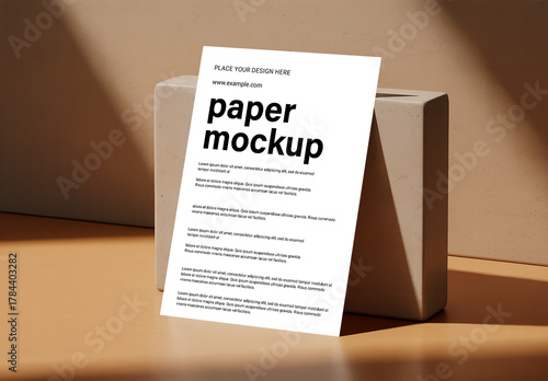 Leaning Paper Mockup on Beige Block with Warm Studio Shadows