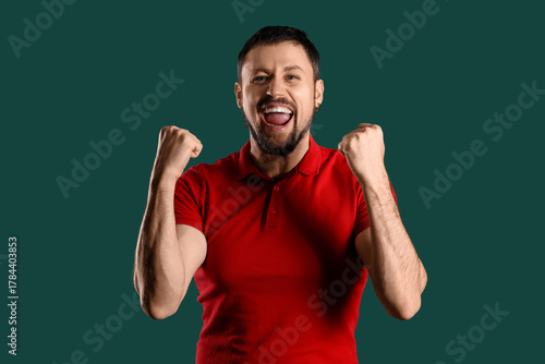 Happy young man screaming o...