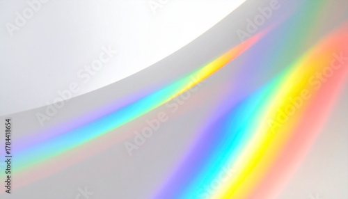 Abstract rainbow light refraction on white background, colorful spectrum overlay for modern design, holographic effect texture