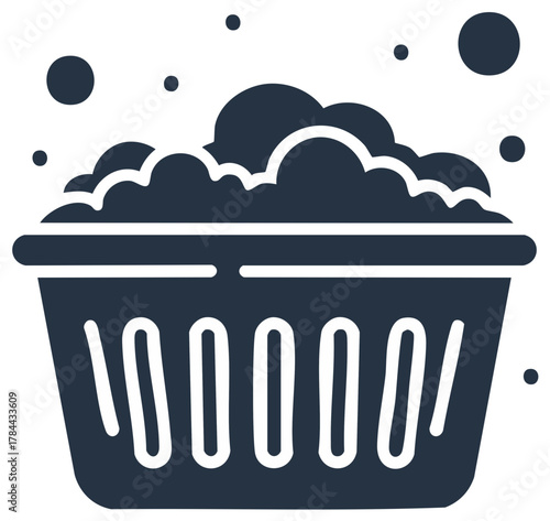 Laundry basket filled with foamy suds for washing items in monochrome style