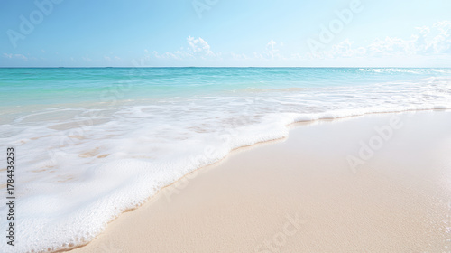 Fototapeta Naklejka Na Ścianę i Meble -  Turquoise sea white sand gentle wave clear sky foam on shore