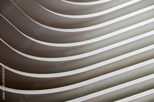 Part view of a built construction with curves, like abstract graphic background in black and white shapes