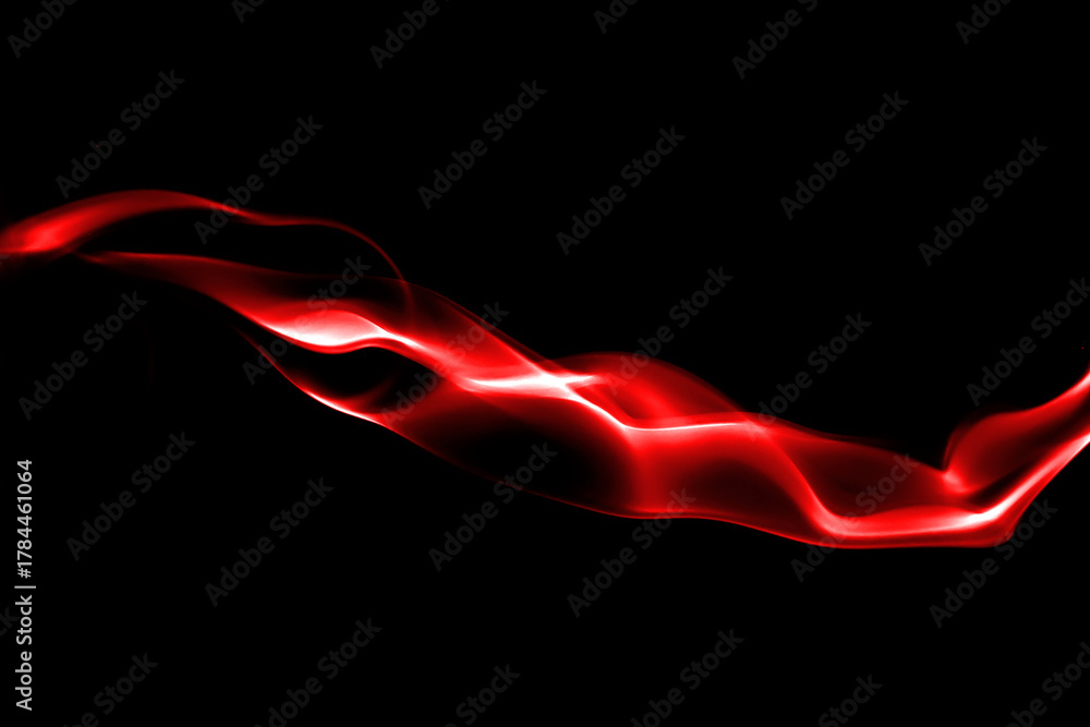 Fototapeta premium Abstract red smoke wave on black background with glowing light effect, symbolizing energy, passion, and motion. Ideal for modern design, background, or digital art concept.