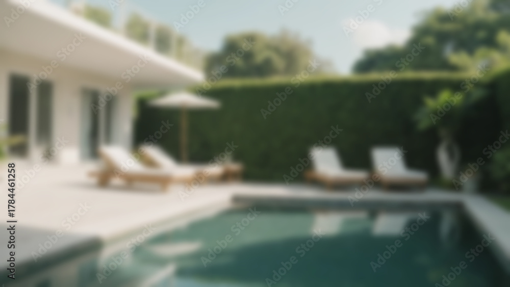 Obraz premium Blurry image of a swimming pool in a modern house, blending with nature with many trees surrounding the pool.