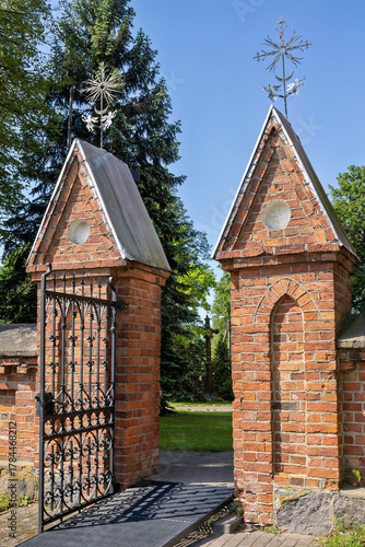 Beautiful brick gate with ornate decorations, on a sunny day