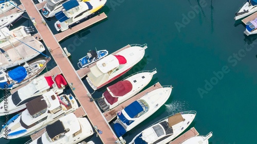 Aerial view of luxury yachts docked in a marina