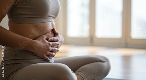 Woman Practicing Yoga for Digestive Health and Wellness.