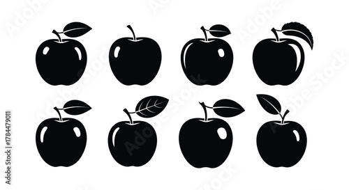 Simple black and white illustration of several apples in various positions