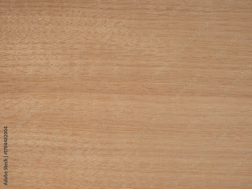 Fototapeta premium Warm Tanganica veneer wood surface with natural grain and texture