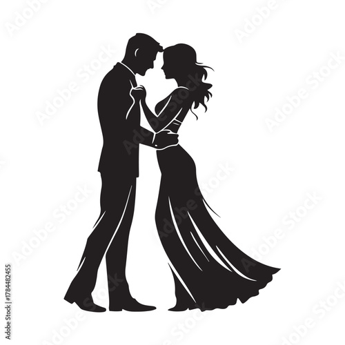 Romantic silhouette of a bride and groom embracing tenderly on their wedding day in a classic elegant pose silhouette