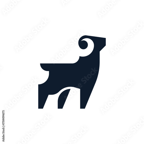 silhouette of a goat with large curved horns logo vector