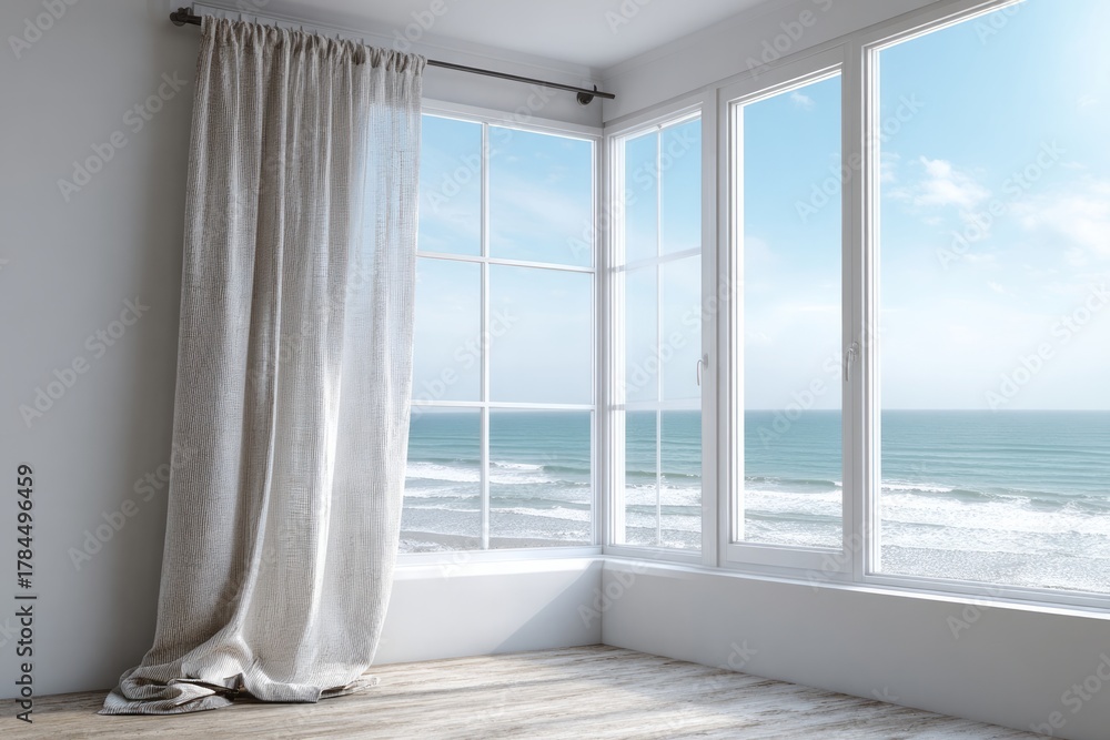 Fototapeta premium Light-filled room with large windows overlooking the ocean.