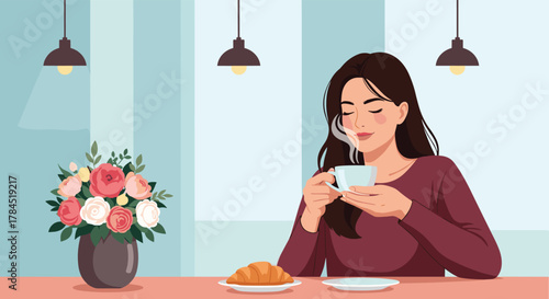 A serene young woman with closed eyes gently inhales the delightful aroma of her hot coffee, enjoying a tranquil moment with a croissant and a beautiful bouquet of flowers.